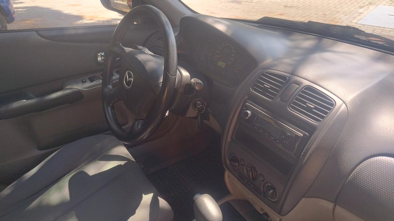 Mazda 323 F 1.6i 16V C. Autom. ASI-CRS clima Ok Neopat.