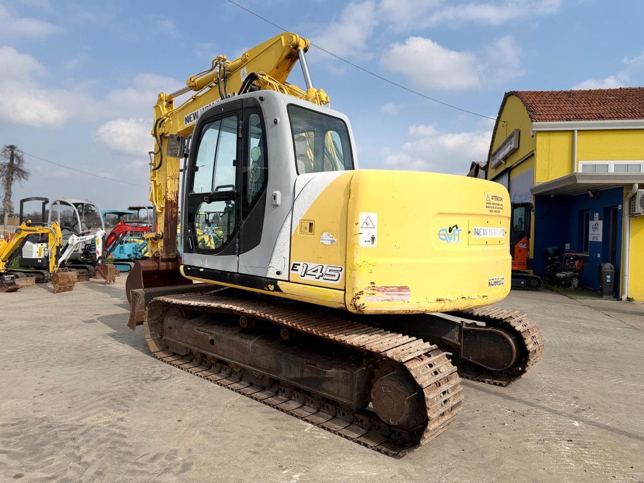 Escavatore NEW HOLLAND E145B TRIPLICE E LAMA